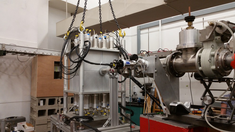 High-Efficiency Total absorption spectrometer Array of 16 NaI(Tl) crystals, each 4x8x8 inch in size arranged in a frame to form a cube 16x16x16 inch with a 60mm borehole in the center for beam pipe