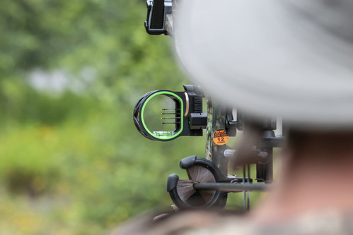Shooting a Compound Bow with sight that uses colored fibers